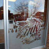 Frosted vinyl graphics to windows